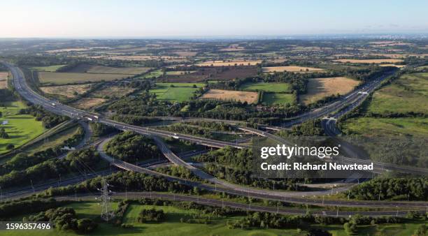 m25 motorway interchange - a blue car driving in speed stock pictures, royalty-free photos & images