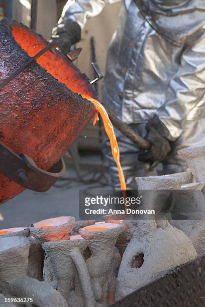 Pouring of molten bronze metal into molds at the casting of the Screen Actors Guild Award statuettes, at the American Fine Arts Foundry on January...