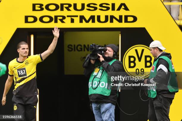 Marcel Sabitzer of Dortmund nwelcomes the fans during the season opening of Borussia Dortmund at Signal Iduna Park on August 06, 2023 in Dortmund,...