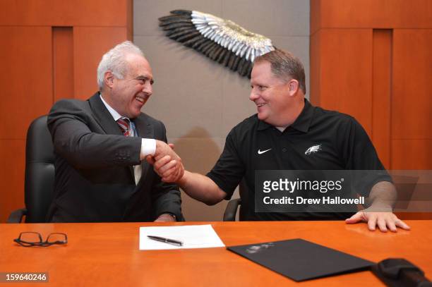Owner Jeffrey Lurie of the Philadelphia Eagles and new head coach Chip Kelly after signing a contract at the NovaCare Complex on January 17, 2013 in...