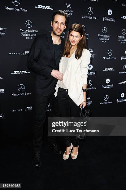 Alexander Mazza and Viola Mazza leave after the Guido Maria Kretschmer Autumn/Winter 2013/14 fashion show during Mercedes-Benz Fashion Week Berlin at...