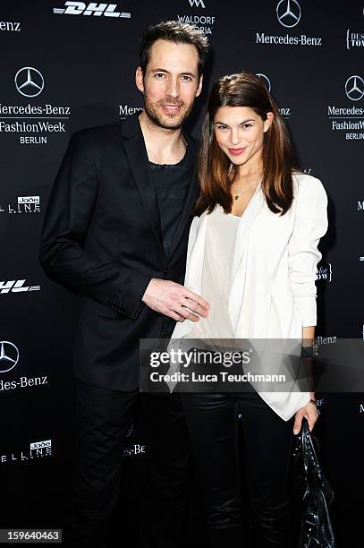 Alexander Mazza and Viola Mazza leave after the Guido Maria Kretschmer Autumn/Winter 2013/14 fashion show during Mercedes-Benz Fashion Week Berlin at...