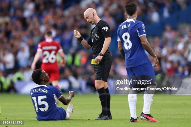 Match referee Anthony Taylor tells off Nicolas Jackson of Chelsea during the Premier League match between Chelsea FC and Liverpool FC at Stamford...