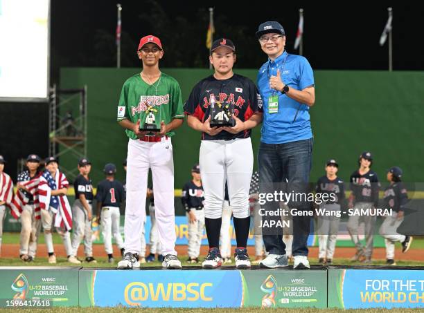 Koma Yusuke of Team Japan pose with best defensive player trophy after the WBSC U-12 Baseball World Cup Bronze Medal game between Japan and Venezuela...
