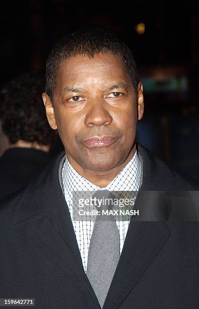 Actor Denzel Washington poses for pictures on the red carpet as he arrives to attend the UK Premiere of his latest film "Flight" in London's...