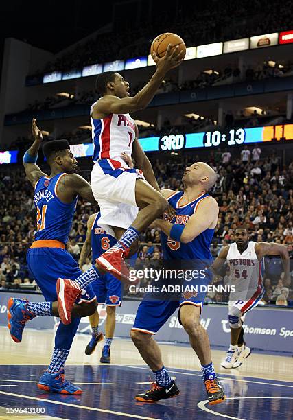 Detroit Pistons' guard Brandon Knight goes to the basket against New York Knicks' guards Jason Kidd and Iman Shumpert during their NBA basketball...