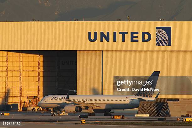 With its Boeing 787 Dreamliner jets grounded, a Boeing 757 jet is parked near a United Airlines hanger before a new day of service as United Airlines...