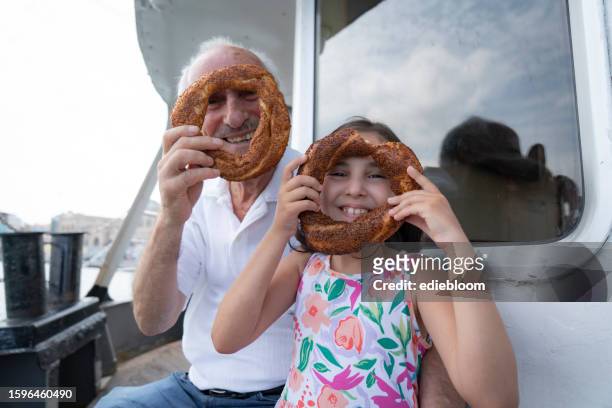 nonno e nipote in viaggio su un traghetto - nautical vessel part foto e immagini stock