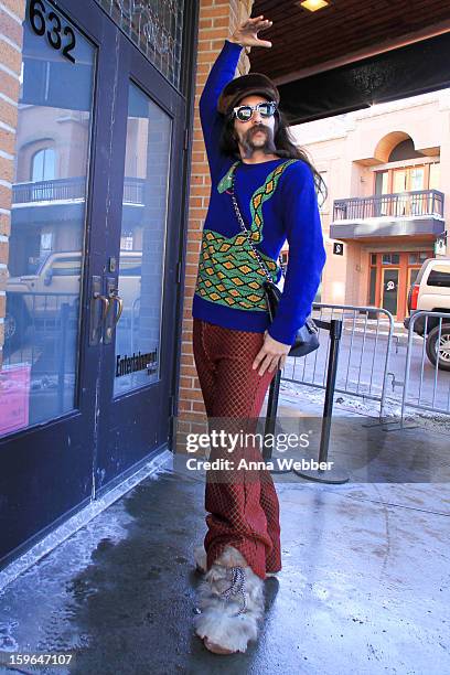 Alexander Antebi, lead singer of Conquistador from Los Angeles, wearing Vintage fur hat, Chanel quilted bag, custom sweater, custom boots, and Zan...