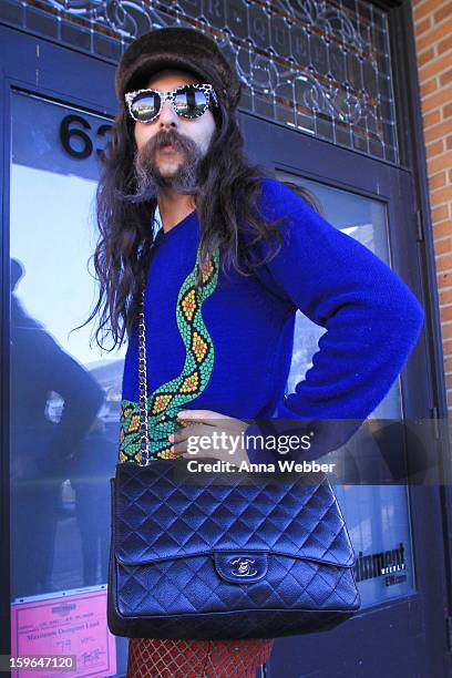 Alexander Antebi, lead singer of Conquistador from Los Angeles, wearing Vintage fur hat, Chanel quilted bag, custom sweater, and Zan Zan sunglasses...