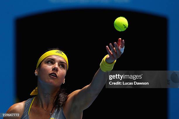 Sorana Cirstea of Romania serves in her third round match against Na Li of China during day five of the 2013 Australian Open at Melbourne Park on...