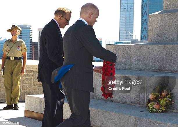 Australian Foreign Minister Bob Carr and British Foreign Secretary William Hague lay wreaths at Kings Park War Memorial before the commencement of...