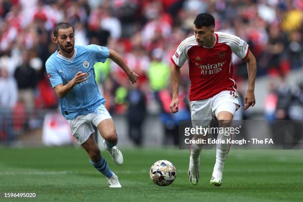 Bernardo Silva of Manchester City battles for possession with Gabriel Martinelli of Arsenal during The FA Community Shield match between Manchester...