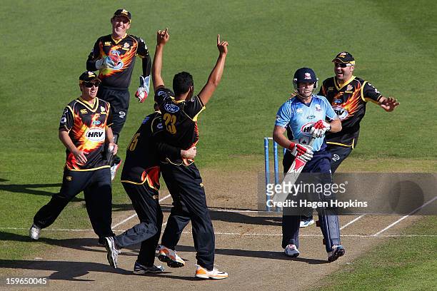 Malaesaili Tugaga of Wellington is congratulated after taking the wicket of Lou Vincent of Auckland during the HRV Cup Twenty20 Preliminary Final...