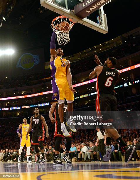 Kobe Bryant of the Los Angeles Lakers dunks the ball in front of Lebron James of the Miami Heat at Staples Center on January 17, 2013 in Los Angeles,...