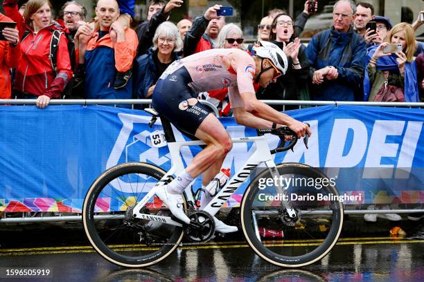 Mathieu Van Der Poel of The Netherlands competes in the breakaway injured after crashes during the 96th UCI Cycling World Championships Glasgow 2023,...