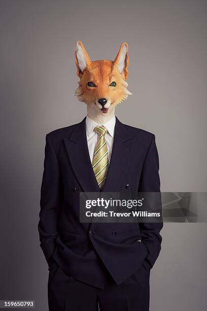 a human figure with a fox head wearing a suit - fox bildbanksfoton och bilder