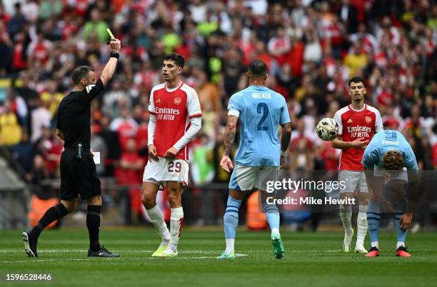 Kai Havertz of Arsenal is shown a yellow card by Referee Stuart Attwell during The FA Community Shield match between Manchester City against Arsenal...