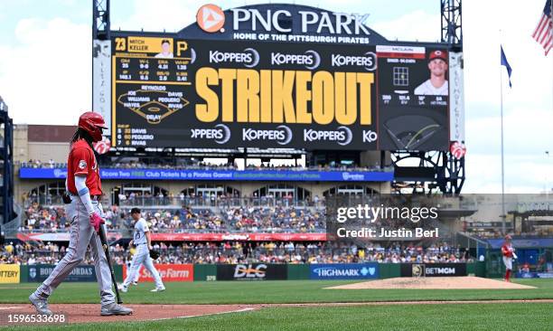 Elly De La Cruz of the Cincinnati Reds walks back to the dugout after being called out on strikes in the fifth inning during game one of a...