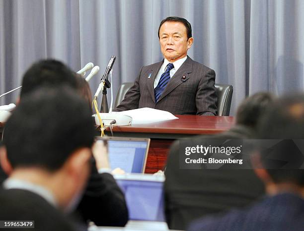 Taro Aso, Japan's deputy prime minister and finance minister, attends a news conference in Tokyo, Japan, on Friday, Jan. 18, 2013. The government and...