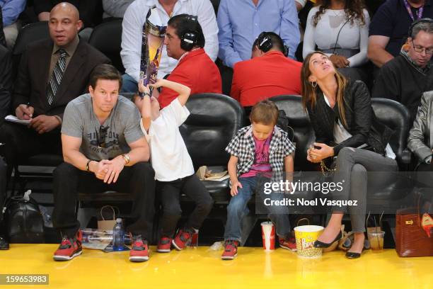 Mark Wahlberg, Michael Wahlberg, Brendan Wahlberg and Rhea Durham attend a basketball game between the Miami Heat and the Los Angeles Lakers at...