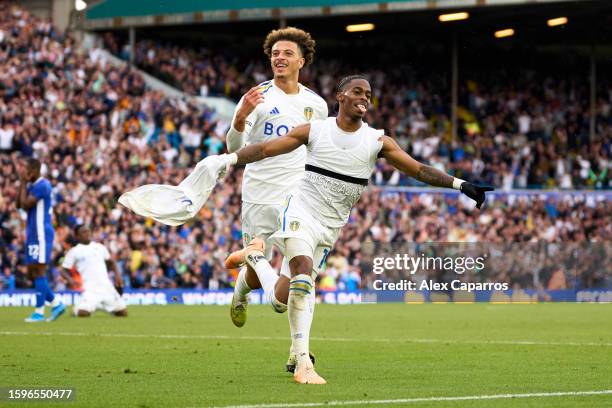 Crysencio Summerville of Leeds United celebrates with his teammate Ethan Ampadu after scoring his team's second goal during the Sky Bet Championship...