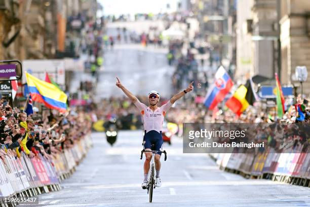 Mathieu Van Der Poel of The Netherlands celebrates at finish line as gold medal winner during the 96th UCI Cycling World Championships Glasgow 2023,...