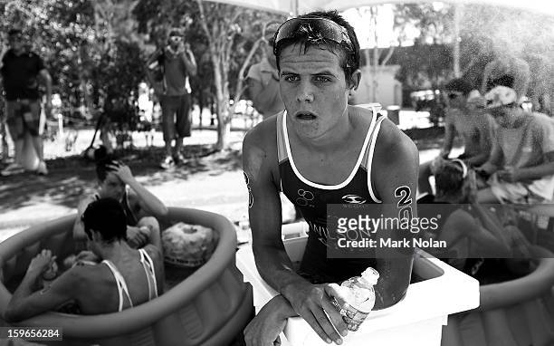 Christian Wilson of Australia and other athletes cool off in ice baths after the Mens Triathlon during day three of the 2013 Australian Youth Olympic...