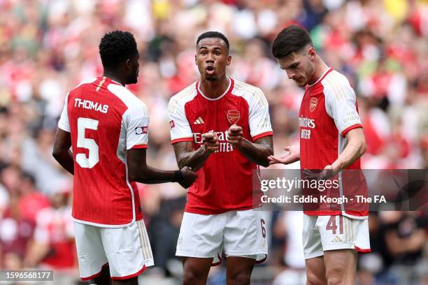 Thomas Partey, Gabriel and Declan Rice of Arsenal interact during The FA Community Shield match between Manchester City against Arsenal at Wembley...