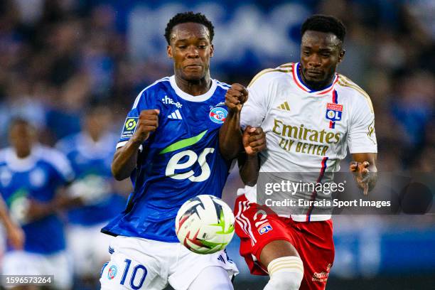 Emmanuel Emegha of Strasbourg battles for the ball with Sinaly Diomande of Lyon during the Ligue 1 Uber Eats match between RC Strasbourg and...