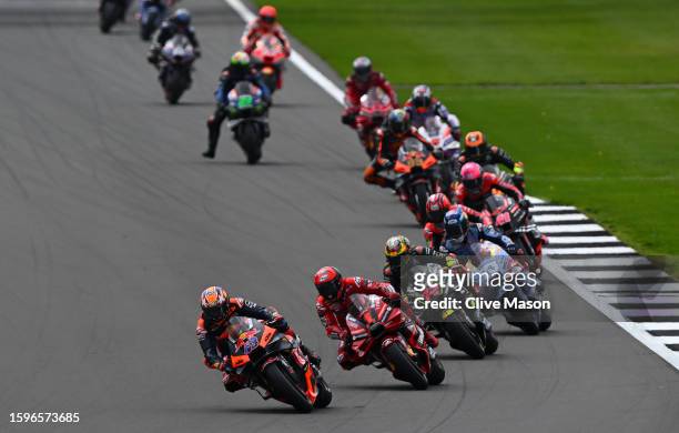 Jack Miller of Australia leads into turn one at the start of the MotoGP of Great Britain - Race at Silverstone Circuit on August 06, 2023 in...
