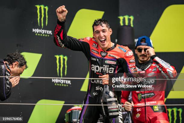 Aleix Espargaro of Spain and Aprilia Racing on the podium after he won the race during the race of the MotoGP Monster Energy British Grand Prix at...