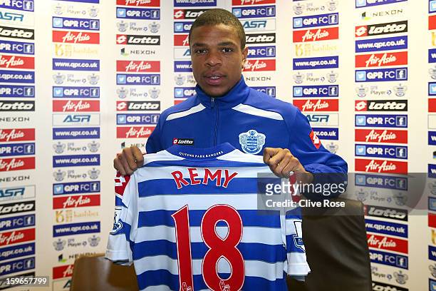 Loic Remy of Queens Park Rangers poses with his new shirt during a press conference to announce his signing to the club on January 18, 2013 in...