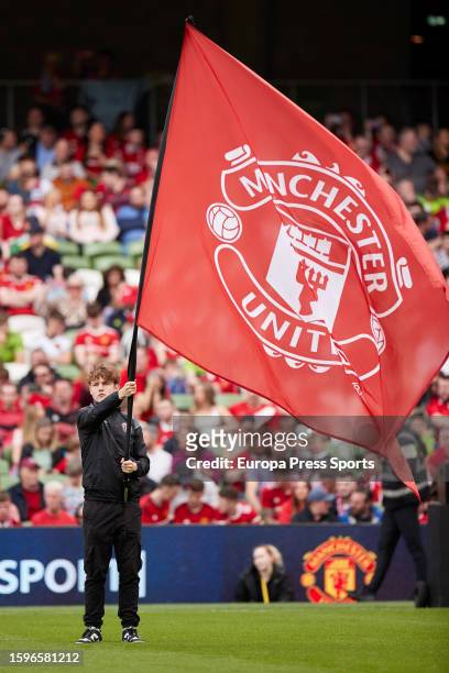 Young man shows a flag of Manchester United prior the pre-season friendly match between Manchester United and Athletic Club at Aviva Stadium on...