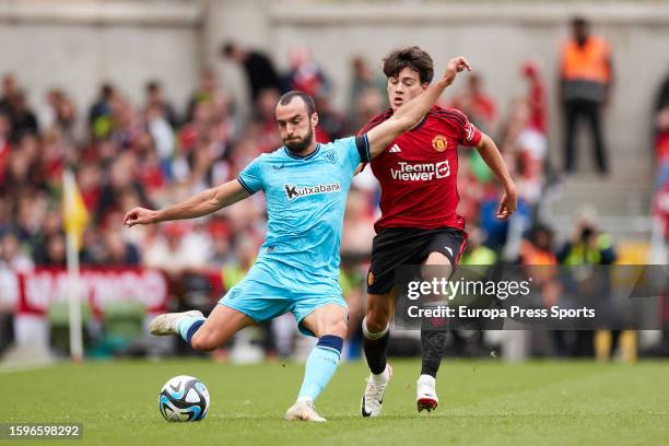 Inigo Lekue of Athletic Club competes for the ball with Facundo Pellistri of Manchester United during the pre-season friendly match between...