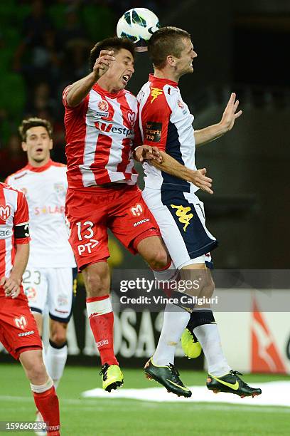 Jonathan Germano of the Heart jumps for a header with Cameron Watson of United during the round seventeen A-League match between Melbourne Heart and...