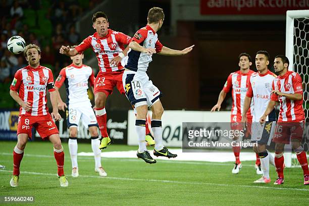 Jonathan Germano of the Heart jumps for a header with Cameron Watson of United during the round seventeen A-League match between Melbourne Heart and...
