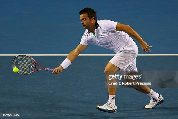 Daniele Bracciali of Italy plays a backhand with Lukas Dlouhy of Czech Republic during their third round doubles match against Alex Bolt of Australia...