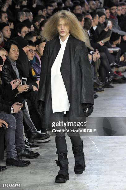 Model walks the runway during the Rick Owens Ready to Wear Fall/Winter 2013-2014 show as part of Paris Fashion Week on January 17, 2013 in Paris,...