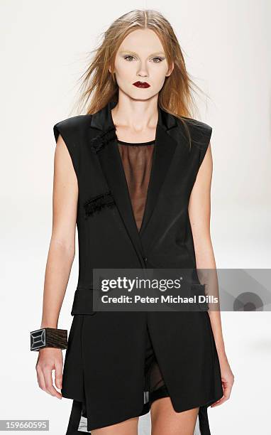 Model walks down the Runway at Irina Schrotter Autumn/Winter 2013/14 fashion show during Mercedes-Benz Fashion Week Berlin at Brandenburg Gate on...