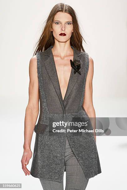 Model walks down the Runway at Irina Schrotter Autumn/Winter 2013/14 fashion show during Mercedes-Benz Fashion Week Berlin at Brandenburg Gate on...