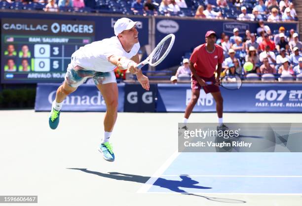 Joe Salisbury of Great Britain hits a shot against Marcelo Arevalo of El Salvador and Jean-Julien Rojer of The Netherlands in the Doubles Final...