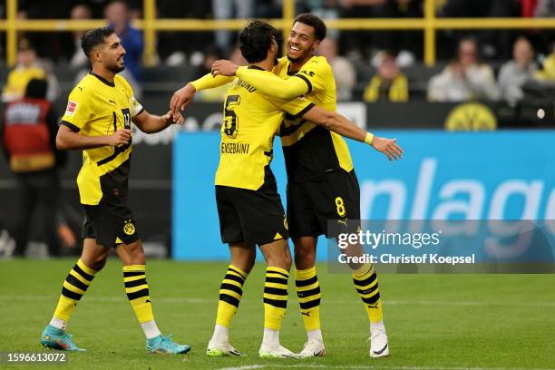 Felix Nmecha of Dortmund celebrates the third goal with Ramy Bensebaini and Emre Can during the Pre-Season friendly match between Borussia Dortmund...