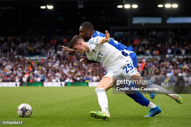 Sam Byram of Leeds United is challenged by Yakou Meite of Cardiff City during the Sky Bet Championship match between Leeds United and Cardiff City at...