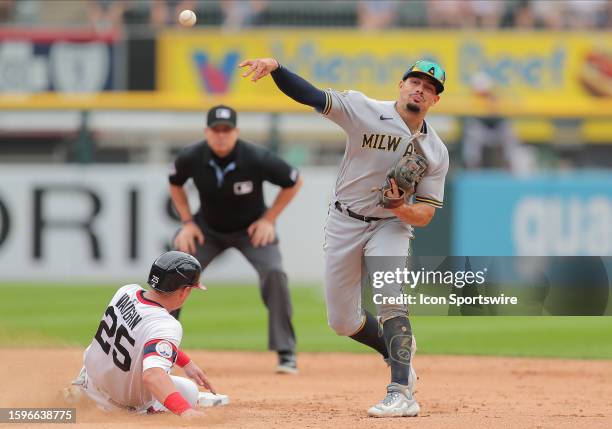 Milwaukee Brewers shortstop Willy Adames throws the ball to first base but the runner beats the throw during a Major League Baseball game between the...