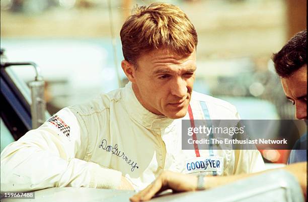 Monterey Grand Prix - Laguna Seca - Can-Am. AAR founder and driver Dan Gurney stands by the paddock. Gurney would qualify his his Chevrolet powered...