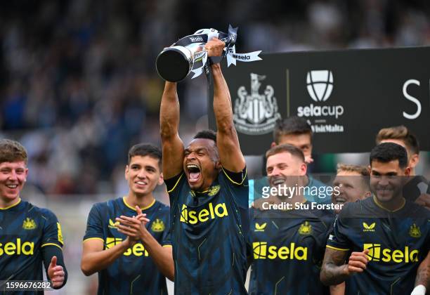 Jacob Murphy of Newcastle lifts the Sela Trophy after the pre-season friendly match between Newcastle United and Villarreal CF at St James' Park on...