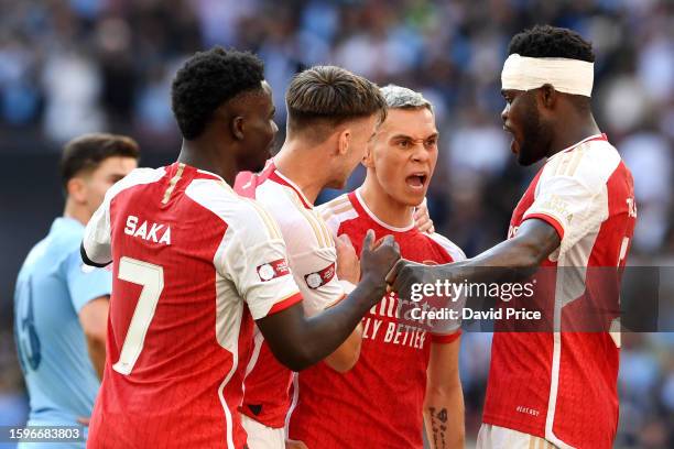 Leandro Trossard of Arsenal celebrates with team mates after scoring their sides first goal during The FA Community Shield match between Manchester...
