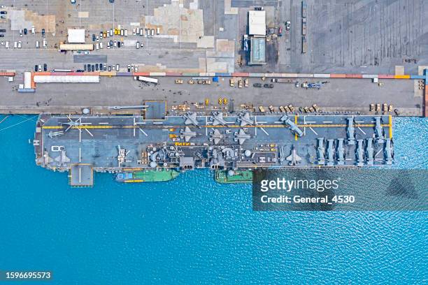 aerial top view of naval ship at blue sea, battle ship, warship, military ship resilient and armed with weapon systems. - preparazione al parto foto e immagini stock