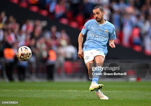 Bernardo Silva of Manchester City scores the team's second penalty in the penalty shoot out during The FA Community Shield match between Manchester...